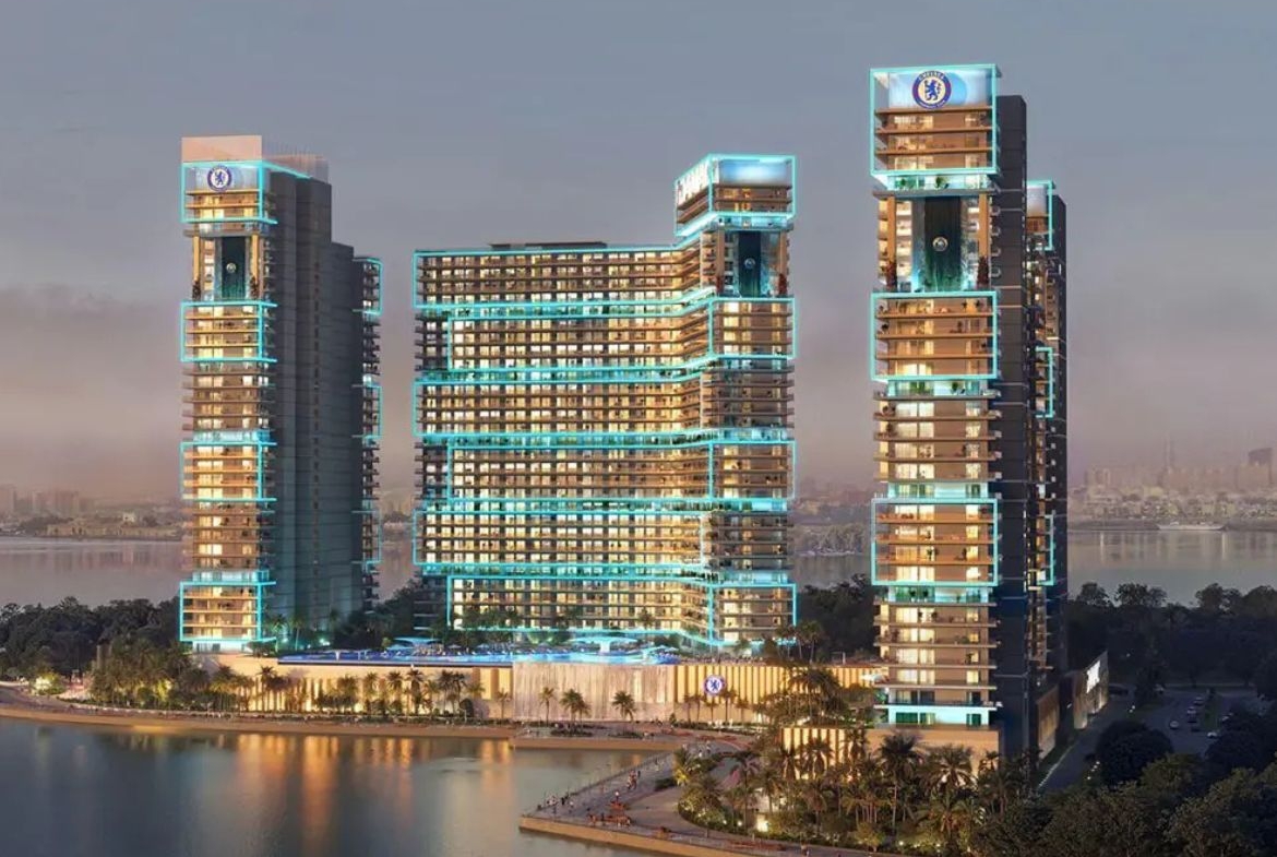 Chelsea Residences waterfront towers with skyline view at sunset – DAMAC Dubai