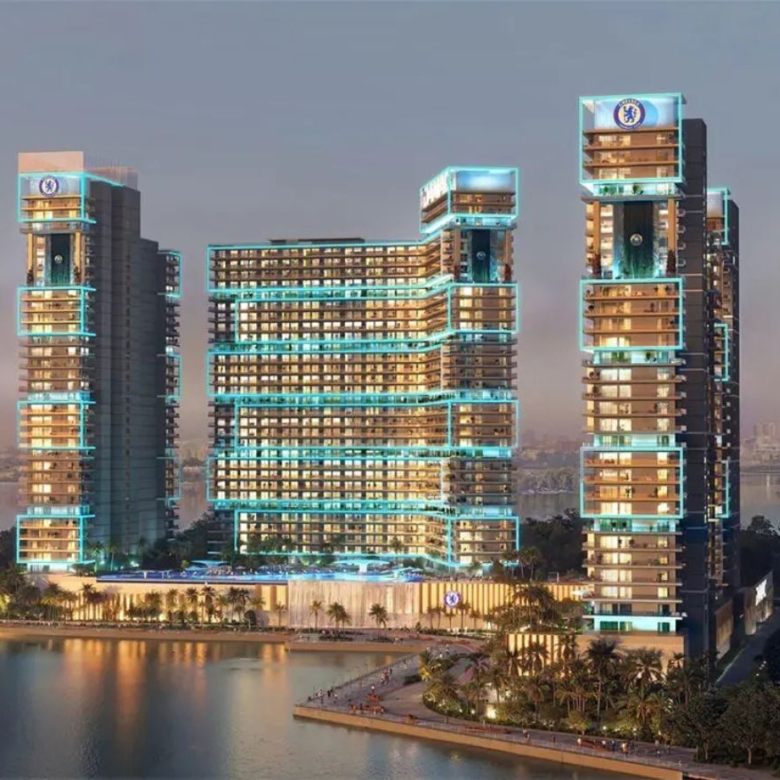 Chelsea Residences waterfront towers with skyline view at sunset – DAMAC Dubai