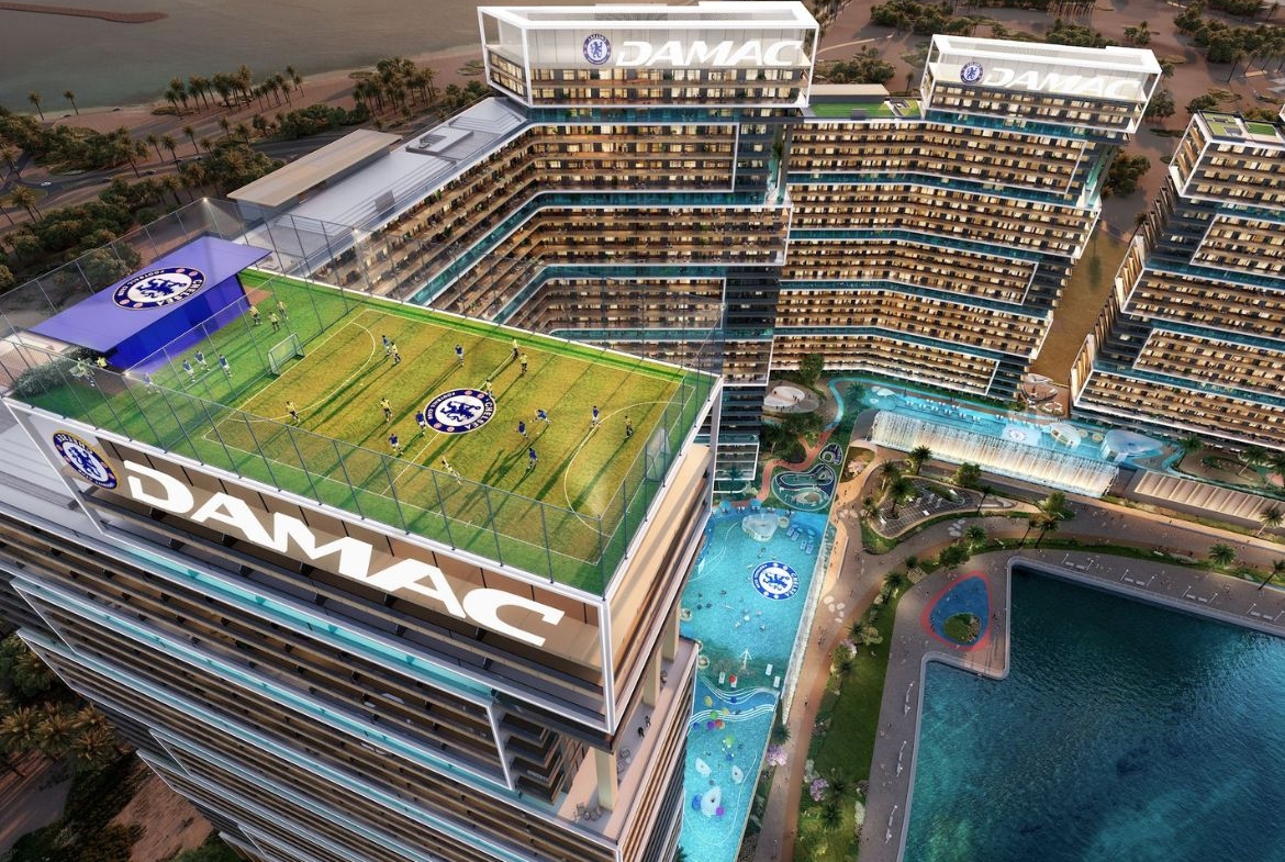 Aerial view of Chelsea Residences with rooftop football field and swimming pools