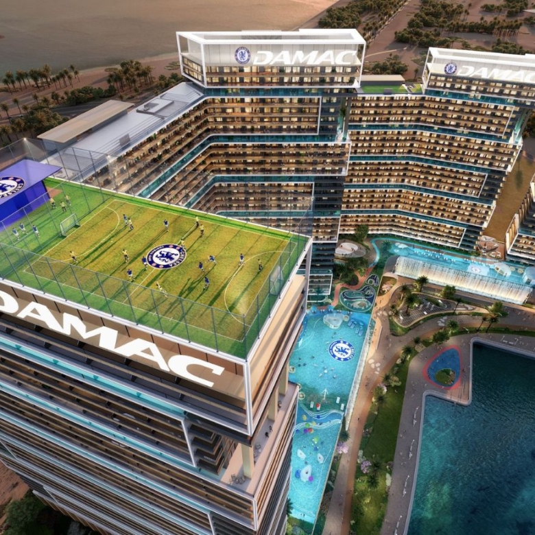 Aerial view of Chelsea Residences with rooftop football field and swimming pools