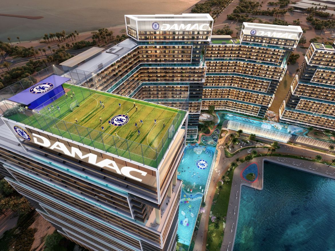 Aerial view of Chelsea Residences with rooftop football field and swimming pools